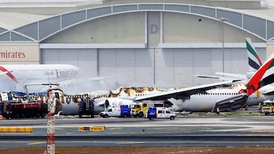 An Emirates airline Boeing 777 plane lays on the ground after crash landing at Dubai International Airport. EPA