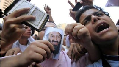 Egyptian protesters chant anti-American slogans and hold a picture of Osama Bin Laden during a protest held by Islamist groups against the killing of Bin Laden, in front of the US embassy in Cairo.