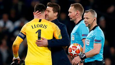 Tottenham Hotspur's Mauricio Pochettino hugs Hugo Lloris after the match. AFP