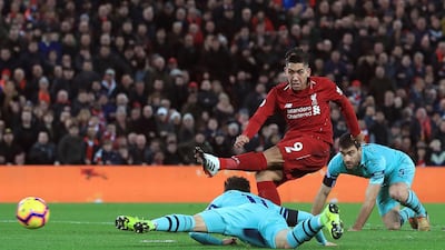 Liverpool's Roberto Firmino scores his side's second goal of the game against Arsenal. PA