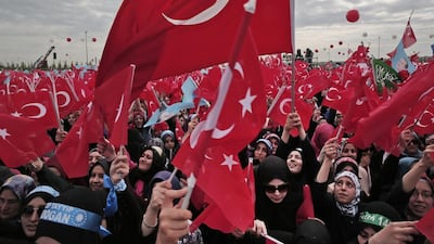 Supporters of Turkish president Recep Tayyip Erdogan sing and wave Turkish flags during at rally in Istanbul on May 30, 2015. The country is heading for fresh elections after no single party won an outright majority in June polls. Lefteris Pitarakis / AP Photo