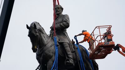Crews remove one of America's largest remaining monuments to the Confederacy, a towering statue of Gen Robert E Lee on Monument Avenue, in Richmond. EPA