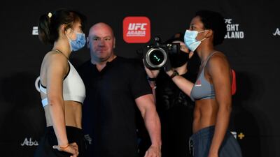 Wu Yanan of China and Joselyne Edwards of Panama face off during the UFC weigh-in at Etihad Arena on UFC Fight Island. Jeff Bottari / Zuffa LLC / Getty Images / UFC