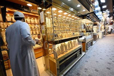 A Kuwaiti man shops for gold jewellery in downtown Kuwait City. AFP