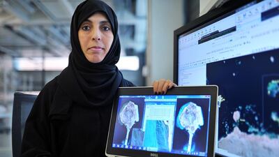 Dr Haifa Ben Romdhane of the Masdar Institute of Science and Technology uses remote sensing equipment to study Abu Dhabi’s coral reefs. Delores Johnson / The National