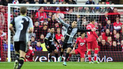 Tottenham's Aaron Lennon celebrates US striker Clint Dempsey's second goal against Southampton. Glyn Kirk/AFP