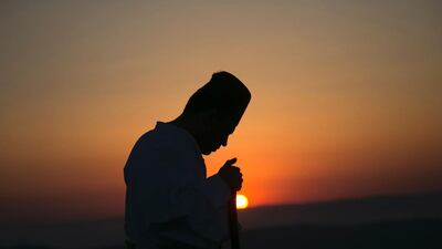 A Samaritan worshiper prays on top of Mount Gerizim near Nablus, West Bank as they celebrate the Shavuot festival at dawn. Jaafar Ashtiyeh / AFP Photo
