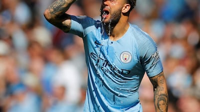 Manchester City's Kyle Walker pours water on himself. Reuters