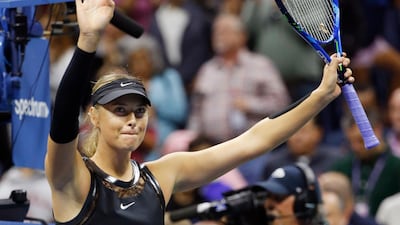 Maria Sharapova wavws to the crowd after her US Open third round victory over Sofia Kenin. Kathy Willens / AP Photo