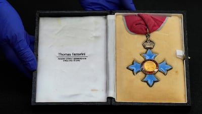 Stephen Hawking's CBE medal. AP