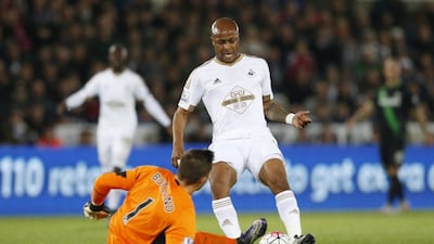 Stoke City keeper Jack Butland challenges Andre Ayew during their Premier League contest on Monday night. Carl Recine / Action Images / Reuters / October 19, 2015