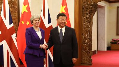 Ms May is greeted by Chinese President Xi Jinping in February 2018 in Beijing, China