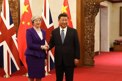 Theresa May with Xi Jinping on her visit to China in 2018. Getty Images