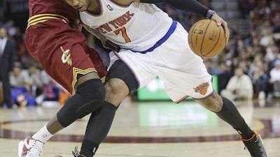 New York Knicks' Carmelo Anthony, right, drives against Cleveland Cavaliers' Luol Deng during an NBA basketball game Saturday, March 8, 2014, in Cleveland. Anthony scored a team-high 26 points in New York's 107-97 win over Cleveland. AP Photo/Tony Dejak