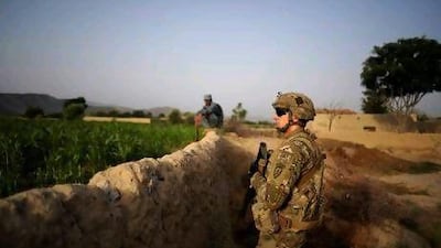 A US Army soldier guards a position during a patrol operation in the village of Zindah Kheyl, Afghanistan. A returned soldier said he sometimes received letters from grade school students addressed to ‘the brave marines in Iraq’.