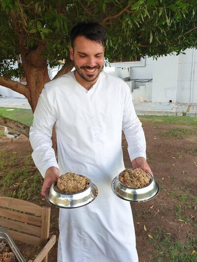 Jamal Al Breiki distributes leftover brunch food to animals in Abu Dhabi. Courtesy Jamal Al Breiki