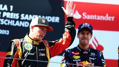 Kimi Raikkonen, left, is a potential teammate of Sebastian Vettel at Red Bull next season. Paul Gilham / Getty Images