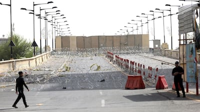 Iraqi riot police stand guard at the Jumhuriyah Bridge, a route leading from Tahrir Square to the Green Zone, on May 6, 2016, a week after Moqtada Al Sadr protesters broke into the fortified Green Zone and stormed the parliament. AFP