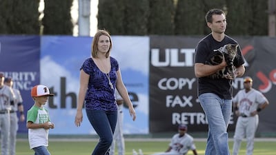 Hero cat Tara held by owner Roger, arrives with the boys she saved, Jeremy Triantafilo and mother Erica. Tara took the internet by storm when she was captured on security camera on May 13 pouncing on a dog that attacked 4-year-old Jeremy Triantafilo.