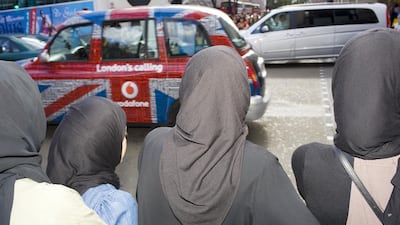 Arab women shopping on London’s busy Oxford Street. The 2.78 million Muslims in Britain contribute £31 billion (Dh185bn) to the country’s economy. Peter Dench / Getty Images