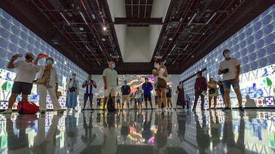 Visitors enjoy the central experience place at the Portugal Pavilion. Victor Besa / The National