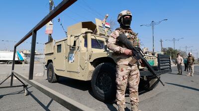 Iraqi soldiers at a checkpoint on January 28, following a reported rocket attack on Baghdad International Airport blamed on Iran-linked militias. AFP