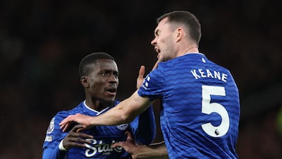 Everton midfielder Idrissa Gueye, left, slaps teammate Michael Keane before receiving a red card in Everton's 1-0 win over Manchester United at Old Trafford. EPA