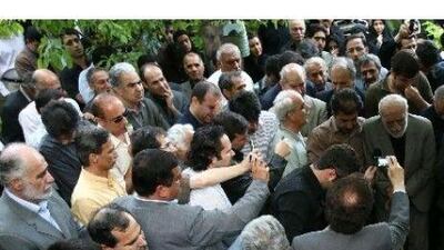 Mourners at the grave of Ezatollah Sahabi at his burial ceremony in Lavasan, northeast of Tehran yesterday, Sahabi's daughter, Haleh Sahabi, also died after being allowed out of prison to attend the funeral of her father. Mohammadreza Abbasi / Mehr News / Reuters
