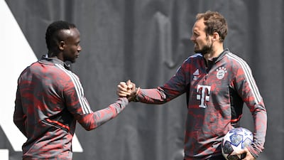 Bayern Munich's Daley Blind trains with Sadio Mane. AFP