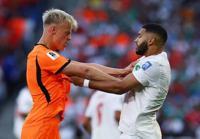 Morocco's Ismael Saibari, right, clashes with Netherlands' Jan Paul van Hecke. Reuters