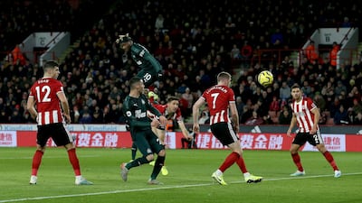 Newcastle winger Allan Saint-Maximin heads home the opening goal. Getty