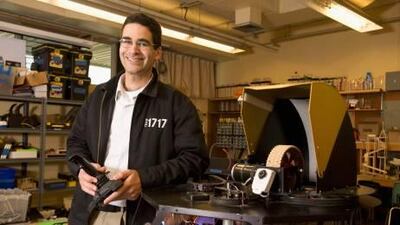 Amir Abo-Shaeer poses with the PenguinBot 4 in the physics lab at Dos Pueblos High School in Goleta, California.