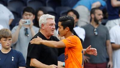 Steve Bruce and Newcastle United's Yoshinori Muto after the match. Reuters
