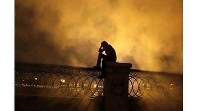 A protester covers his face to protect himself from tear gas near Tahrir Square in Cairo. A reader comments that the bigoted movie that has sparked worldwide protests does not represent most Americans. Amr Abdallah Dalsh / Reuters