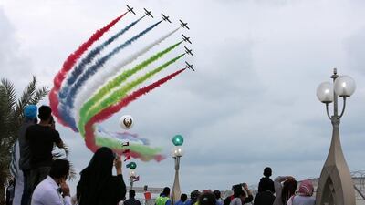 People watching the air show by UAE flying team Al Fursan. Pawan Singh / The National