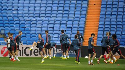 Bayern Munich’s football players take part in a training session at the Santiago Bernabeu stadium in Madrid on April 22, 2014 on the eve of their Uefa Champions League semifinal first leg football match Real Madrid CF vs Bayern Munich. AFP PHOTO/ PEDRO ARMESTRE