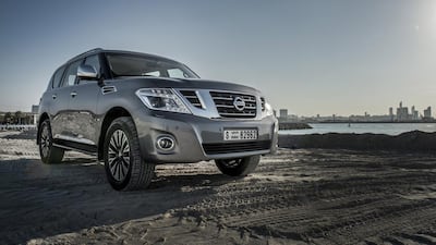 Nissan Patrol V6 with Abu Dhabi skyline behind. The Japanese car maker has seen earnings rise. Vidhyaa / The National