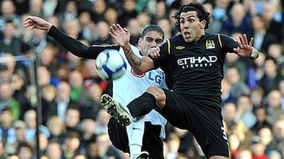 Carlos Tevez, right, scored Manchester City's second and decisive goal against Fulham.