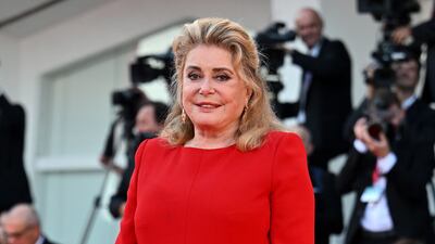 Catherine Deneuve in red Saint Laurent. EPA