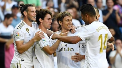 Real Madrid's Croatian midfielder Luka Modric, centre, celebrates after scoring. AFP