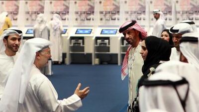 Dr Anwar Mohammad Al Gargash, Minister of State for Foreign Affairs and Minister of State for FNC Affairs (second from left) greets some of the candidates in Abu Dhabi.