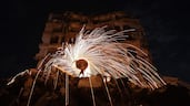 A Palestinian sets off fireworks after breaking his fast at the Jabalia refugee camp, in northern Gaza. AFP