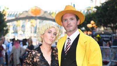 Cosplayers David Tracy, right, and Hayley Tracy portray Dick Tracy and Breathless Mahoney. AFP