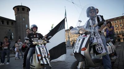 Juventus supporter's celebrate the club's 30th Italian Serie A title on Sunday. Marco Bertorello / AFP / May 4, 2014
