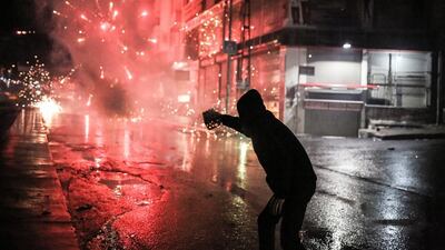 A Kurdish militant fires fireworks at Turkish riot police on November 28, 2015, during a demonstration in the Gazi district of Istanbul, after a top Kurdish lawyer was killed in the mainly Kurdish province of Diyarbakir. The lawyer and 40 other activists were holding a press conference near a mosque in the city’s Sur district when unknown attackers opened fire on the gathering, triggering a shoot-out with police, witnesses said. Cagdas Erdogan / Agence France-Presse