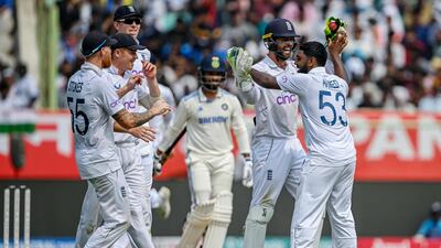England's Rehan Ahmed, right, celebrates with teammates after taking the wicket of India's Rajat Patidar. AFP