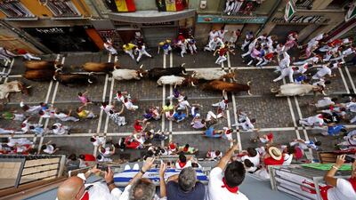 Bulls of the Pedraza de Yeltes ranch chase runners or ‘mozos’ during the fourth bull run at the Festival of San Fermin 2016 in Pamplona, Spain. Javier Lizon / EPA