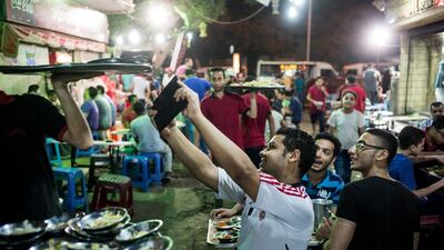 Customers snapping selfies at Wimby as people gather for a bit of fun during suhoor. David Degner for The National