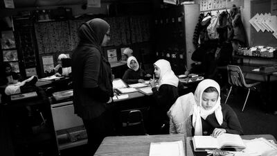 Veiled girls in class in Illinois.