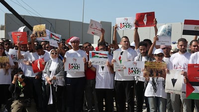 Pro-Palestinian demontrators gather as UN Secretary General Antonio Guterres visits the Rafah border crossing between Egypt and the Gaza Strip. Reuters